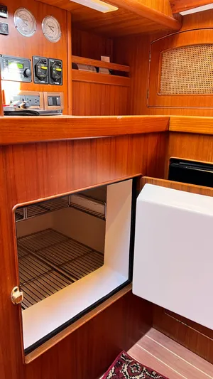 La Vie Dansante Yacht Photos Pics Interior of 1998 Little Harbor WhisperJet 55 yacht with wooden cabinetry and built-in storage.