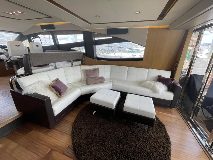 Kings' Ransom Yacht Photos Pics Luxurious 2017 Sea Ray L590 Fly yacht interior with white leather seating and plush cushions.