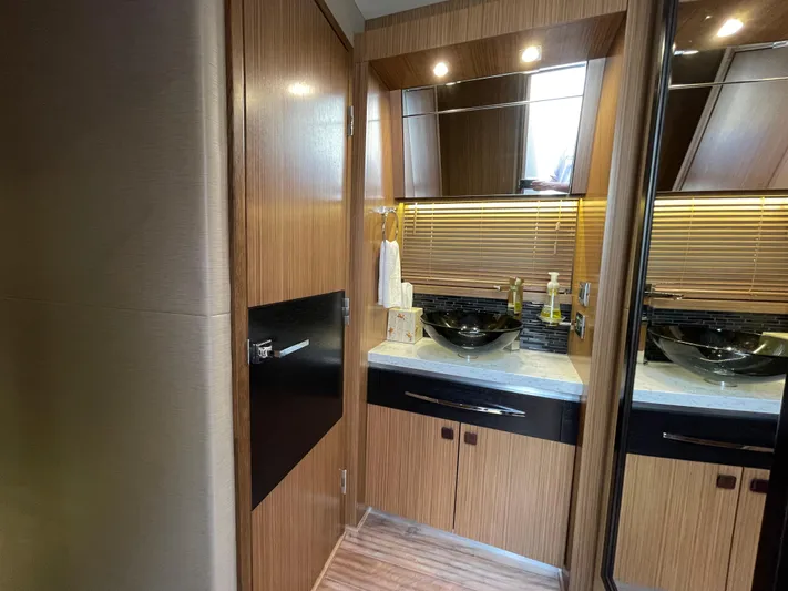 Kings' Ransom Yacht Photos Pics Luxurious bathroom interior of 2017 Sea Ray L590 Fly yacht with modern fixtures.