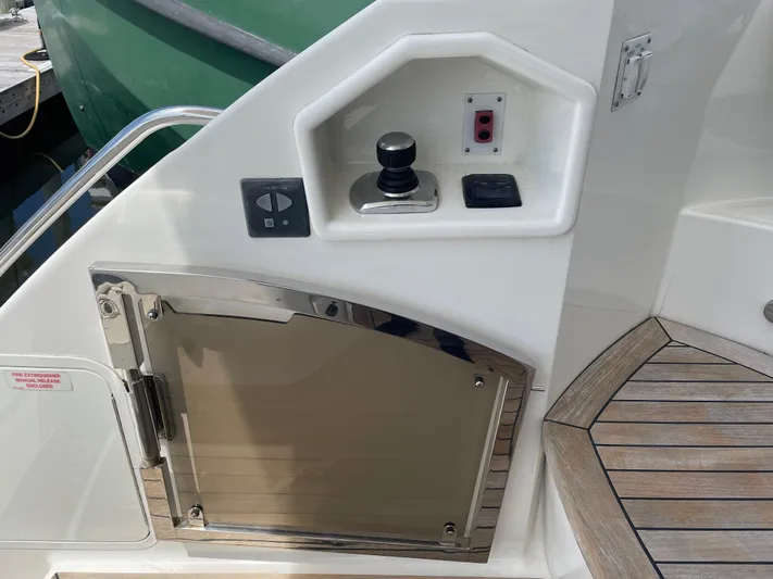 Kings' Ransom Yacht Photos Pics Control panel and storage on 2017 Sea Ray L590 Fly yacht deck.