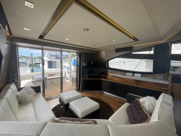Kings' Ransom Yacht Photos Pics Luxurious interior of 2017 Sea Ray L590 Fly yacht with modern furnishings and marina view.