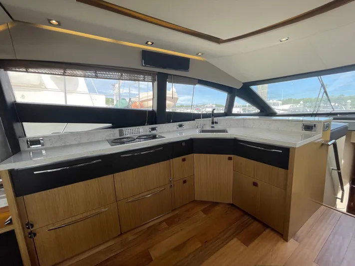 Kings' Ransom Yacht Photos Pics Luxurious kitchen interior of 2017 Sea Ray L590 Fly yacht with modern design.