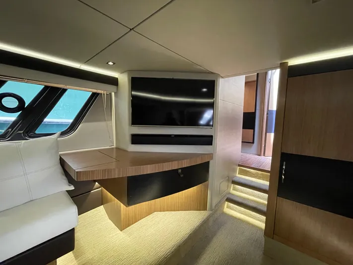 Kings' Ransom Yacht Photos Pics Luxurious interior of 2017 Sea Ray L590 Fly yacht with modern furnishings and TV.