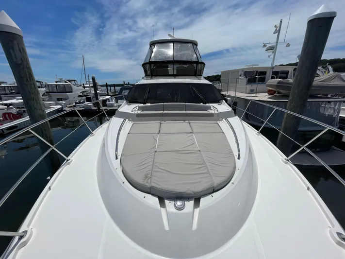 Kings' Ransom Yacht Photos Pics 2017 Sea Ray L590 Fly yacht docked at marina under blue sky.