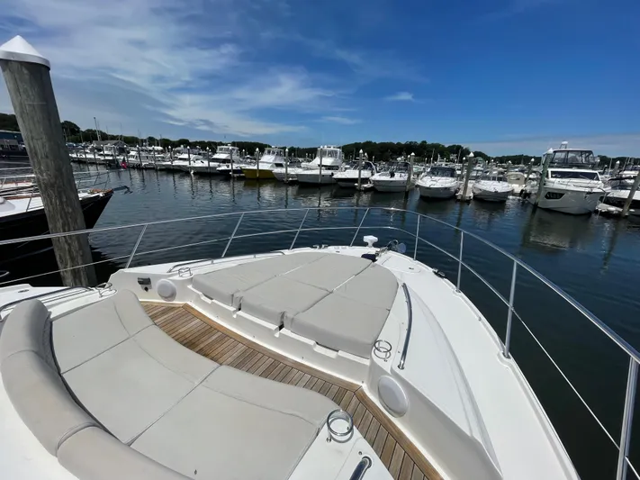Kings' Ransom Yacht Photos Pics 2017 Sea Ray L590 Fly yacht docked at a marina under a clear blue sky.