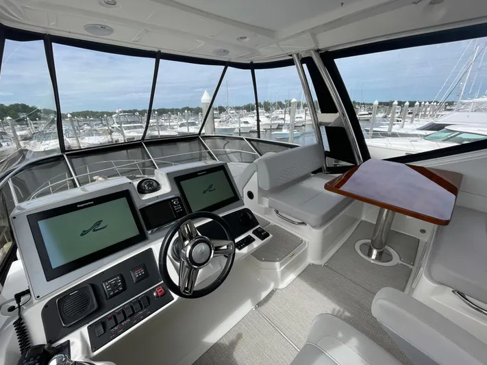 Kings' Ransom Yacht Photos Pics 2017 Sea Ray L590 Fly yacht cockpit with modern controls and marina view.