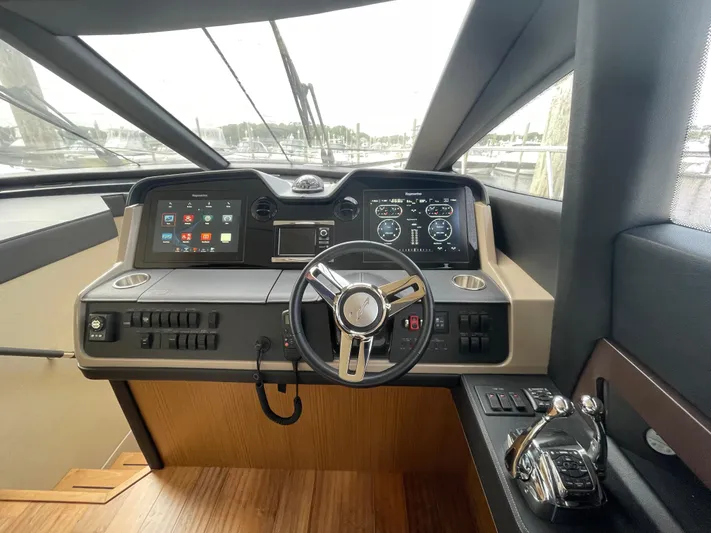 Kings' Ransom Yacht Photos Pics 2017 Sea Ray L590 Fly yacht helm with modern controls and navigation displays.