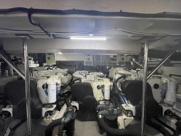 Kings' Ransom Yacht Photos Pics Engine room of 2017 Sea Ray L590 Fly yacht, showcasing dual engines and mechanical components.