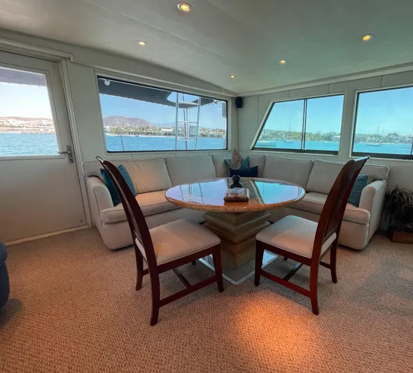Fnfun Yacht Photos Pics Luxurious 1989 Hatteras CPMY yacht interior with elegant seating and ocean view.