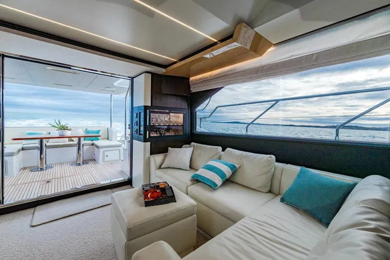 Mahalo Yacht Photos Pics Luxurious interior of 2019 Azimut 66 yacht with ocean view and elegant seating.