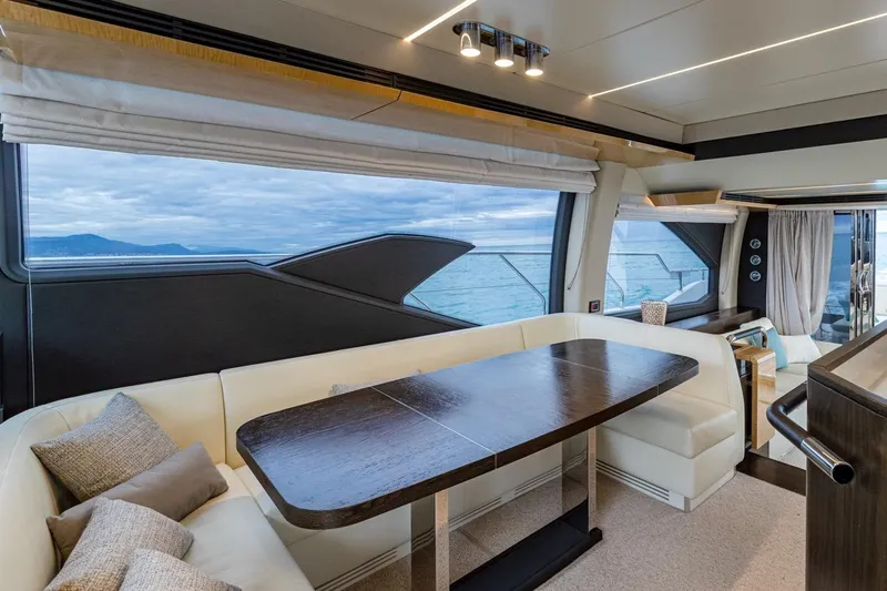 Mahalo Yacht Photos Pics Luxurious interior of 2019 Azimut 66 yacht with ocean view through large windows.