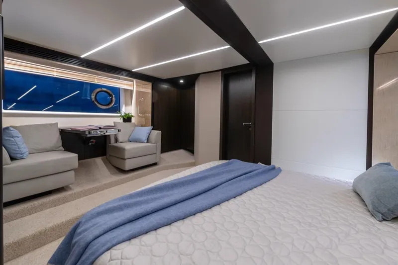 Mahalo Yacht Photos Pics Luxurious interior of 2019 Azimut 66 yacht with modern seating and elegant decor.