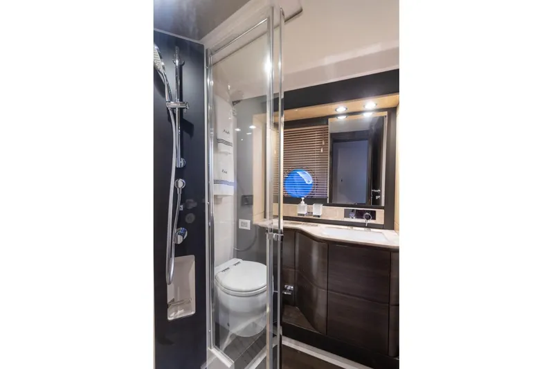 Mahalo Yacht Photos Pics Luxurious bathroom in 2019 Azimut 66 yacht with modern shower and sleek vanity.