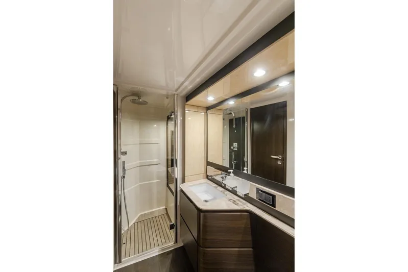 Mahalo Yacht Photos Pics Luxurious bathroom in 2019 Azimut 66 yacht, featuring modern fixtures and elegant design.
