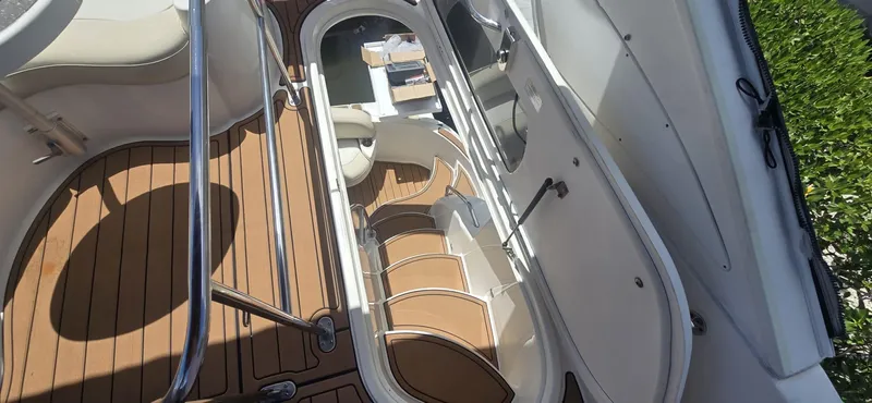  Yacht Photos Pics 2012 Meridian 341 Sedan boat interior with open hatch and wooden flooring.