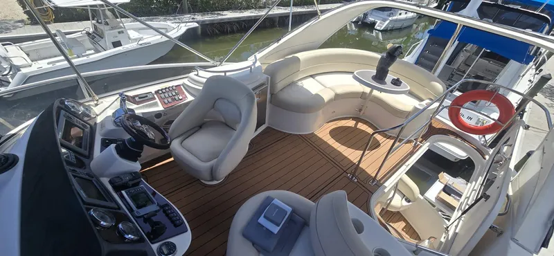  Yacht Photos Pics Luxurious 2012 Meridian 341 Sedan yacht interior with plush seating and modern helm controls.