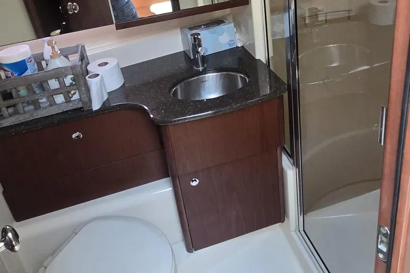  Yacht Photos Pics Bathroom in 2012 Meridian 341 Sedan with sink, toilet, and shower.