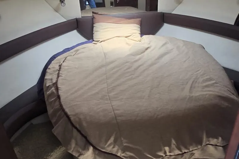  Yacht Photos Pics Cozy bedroom interior of 2012 Meridian 341 Sedan yacht with round bed.