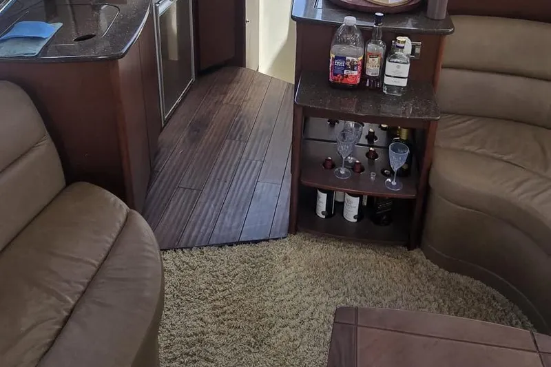  Yacht Photos Pics Luxurious interior of 2012 Meridian 341 Sedan yacht with plush seating and mini bar.