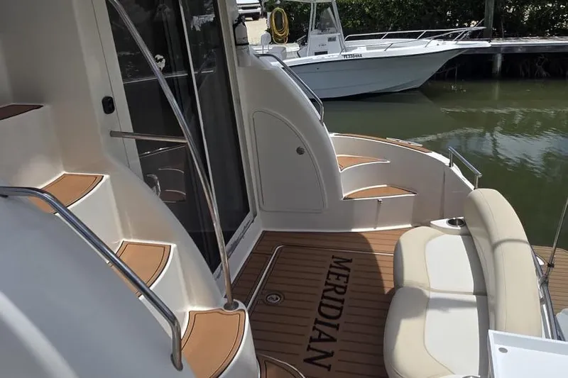  Yacht Photos Pics 2012 Meridian 341 Sedan yacht interior with elegant seating and teak flooring.