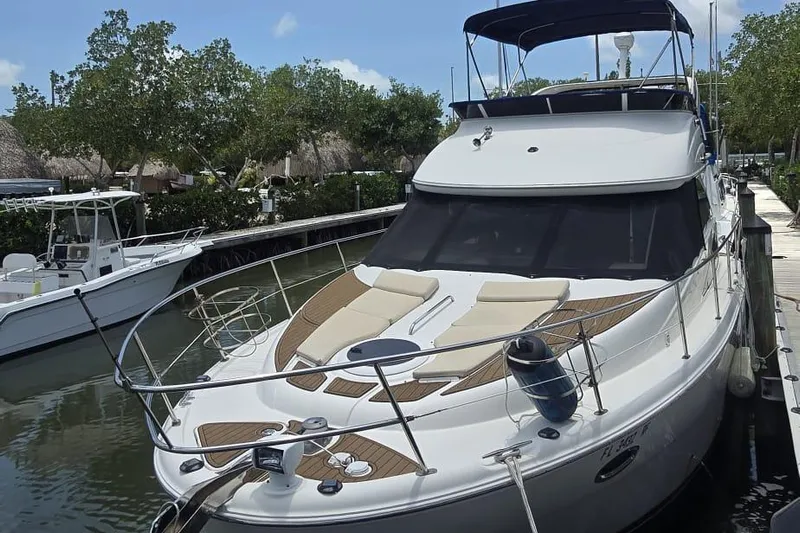  Yacht Photos Pics 2012 Meridian 341 Sedan yacht docked, featuring sleek design and spacious deck.