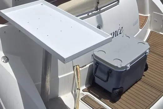  Yacht Photos Pics 2012 Meridian 341 Sedan boat with a white table and gray cooler on deck.