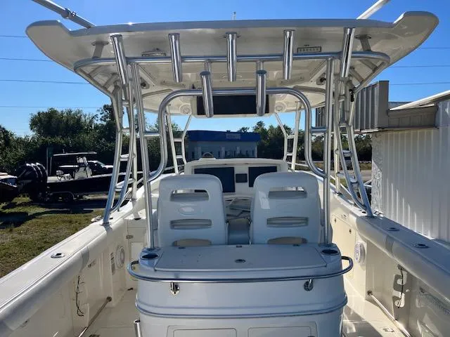  Yacht Photos Pics 2016 Boston Whaler 320 Outrage Cuddy Cabin boat interior with seating and rod holders.