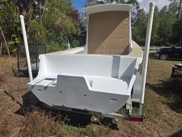 Custom Porter Lobster Boat 2021 parked on trailer outdoors.