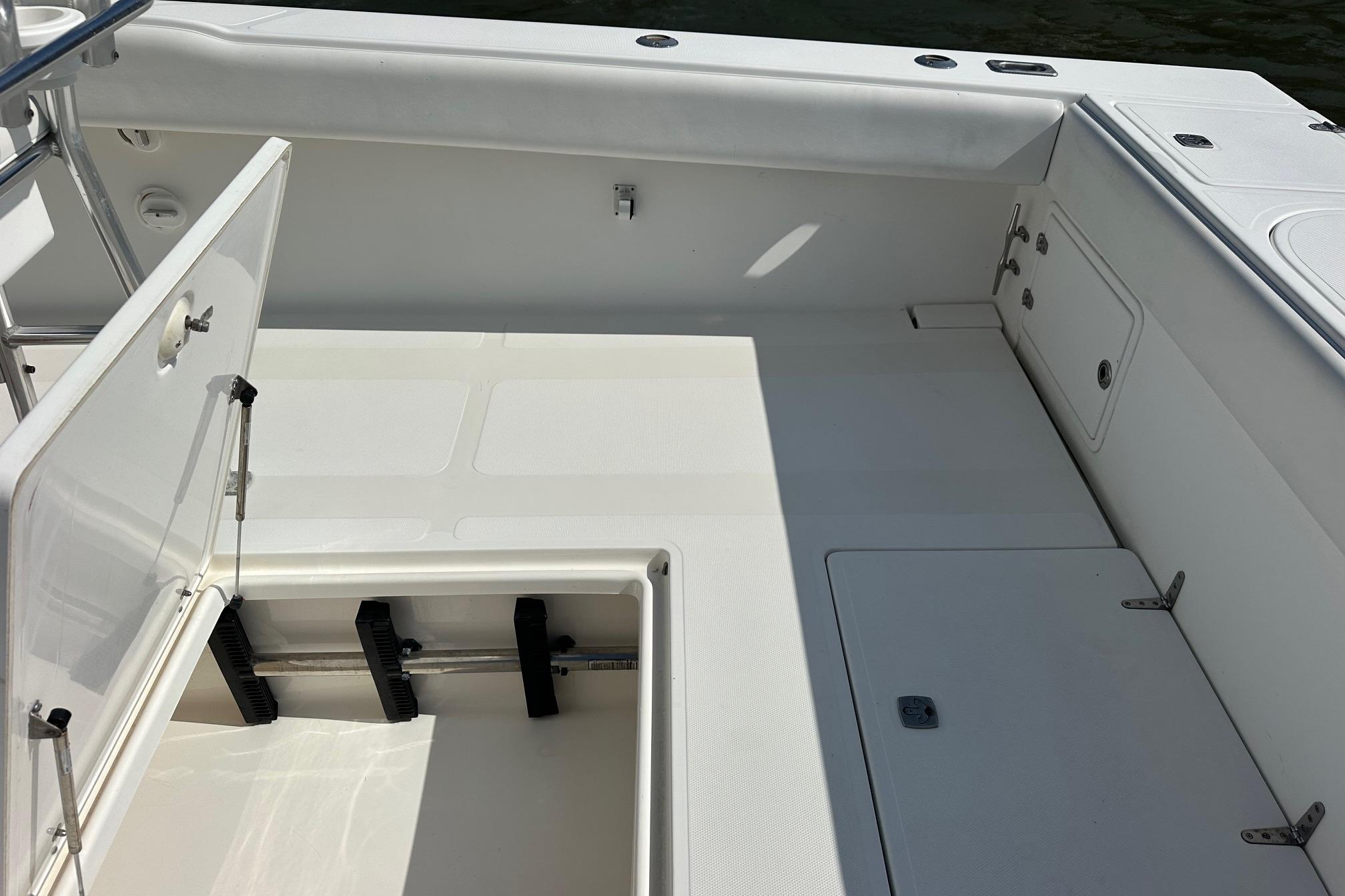 2003 Venture 34 Center Console boat interior with open storage compartments.