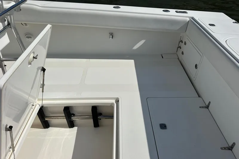  Yacht Photos Pics 2003 Venture 34 Center Console boat interior with open storage compartments.