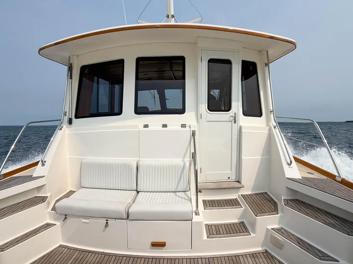 Bira Yacht Photos Pics 2006 Grand Banks 49 Eastbay SX yacht with rear seating and ocean view.