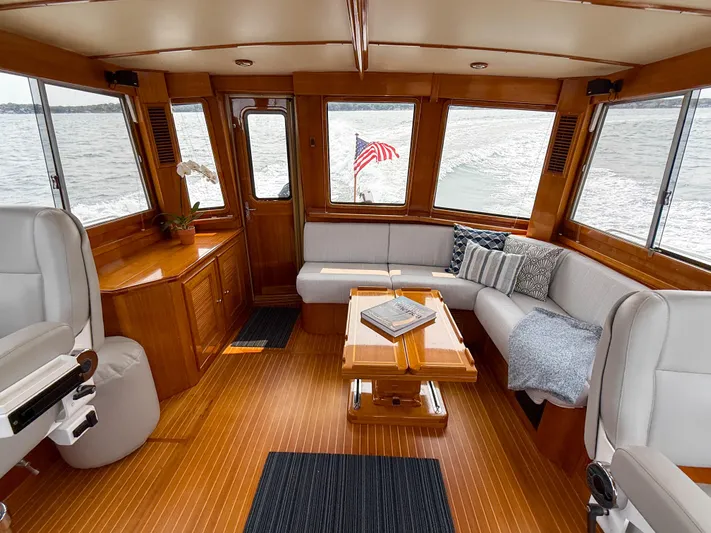 Bira Yacht Photos Pics Luxurious 2006 Grand Banks 49 Eastbay SX yacht interior with elegant seating and wooden finishes.