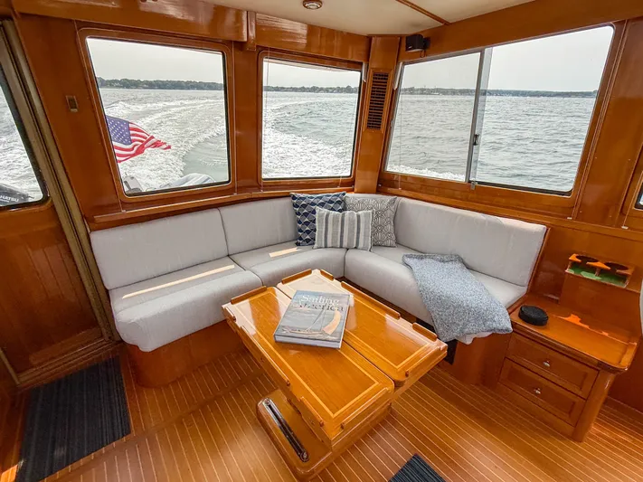 Bira Yacht Photos Pics Luxurious 2006 Grand Banks 49 Eastbay SX yacht interior with elegant seating and ocean view.