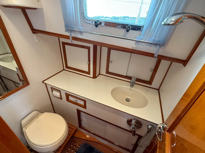 Bira Yacht Photos Pics Luxurious 2006 Grand Banks 49 Eastbay SX yacht bathroom with sink and toilet.