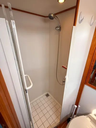 Bira Yacht Photos Pics Shower area in 2006 Grand Banks 49 Eastbay SX yacht, featuring a compact design.