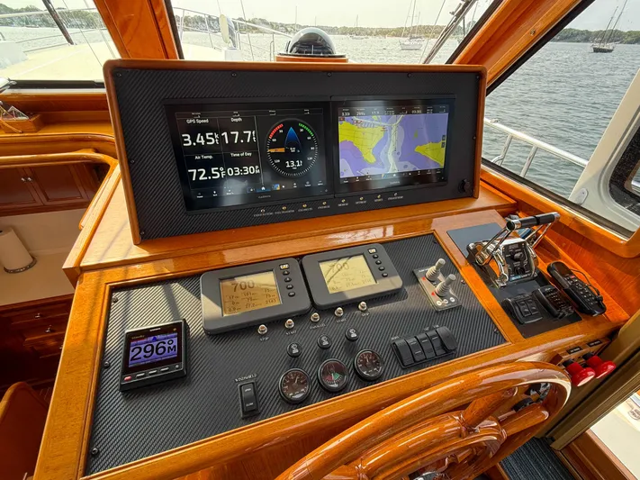 Bira Yacht Photos Pics Helm of 2006 Grand Banks 49 Eastbay SX with navigation screens and controls.