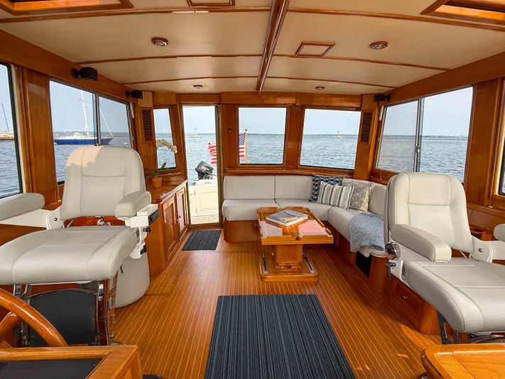 Bira Yacht Photos Pics Luxurious 2006 Grand Banks 49 Eastbay SX yacht interior with elegant seating and panoramic windows.