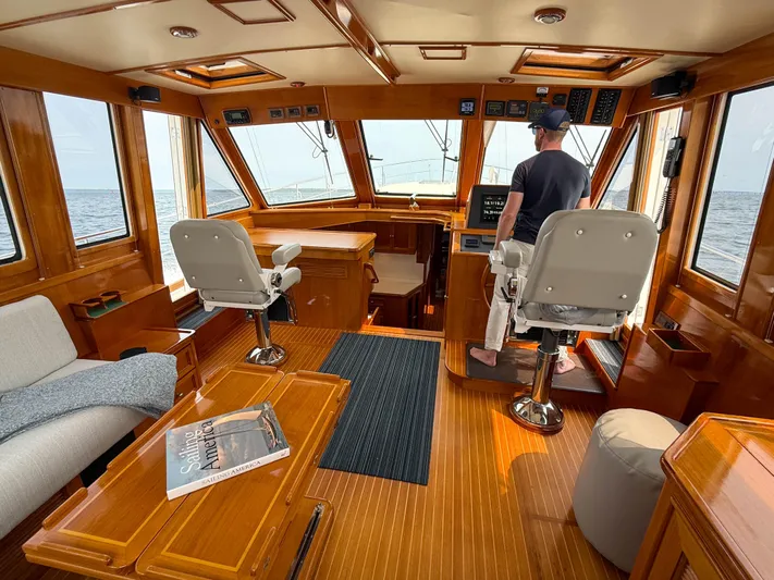 Bira Yacht Photos Pics 2006 Grand Banks 49 Eastbay SX yacht interior with helm, seating, and ocean view.