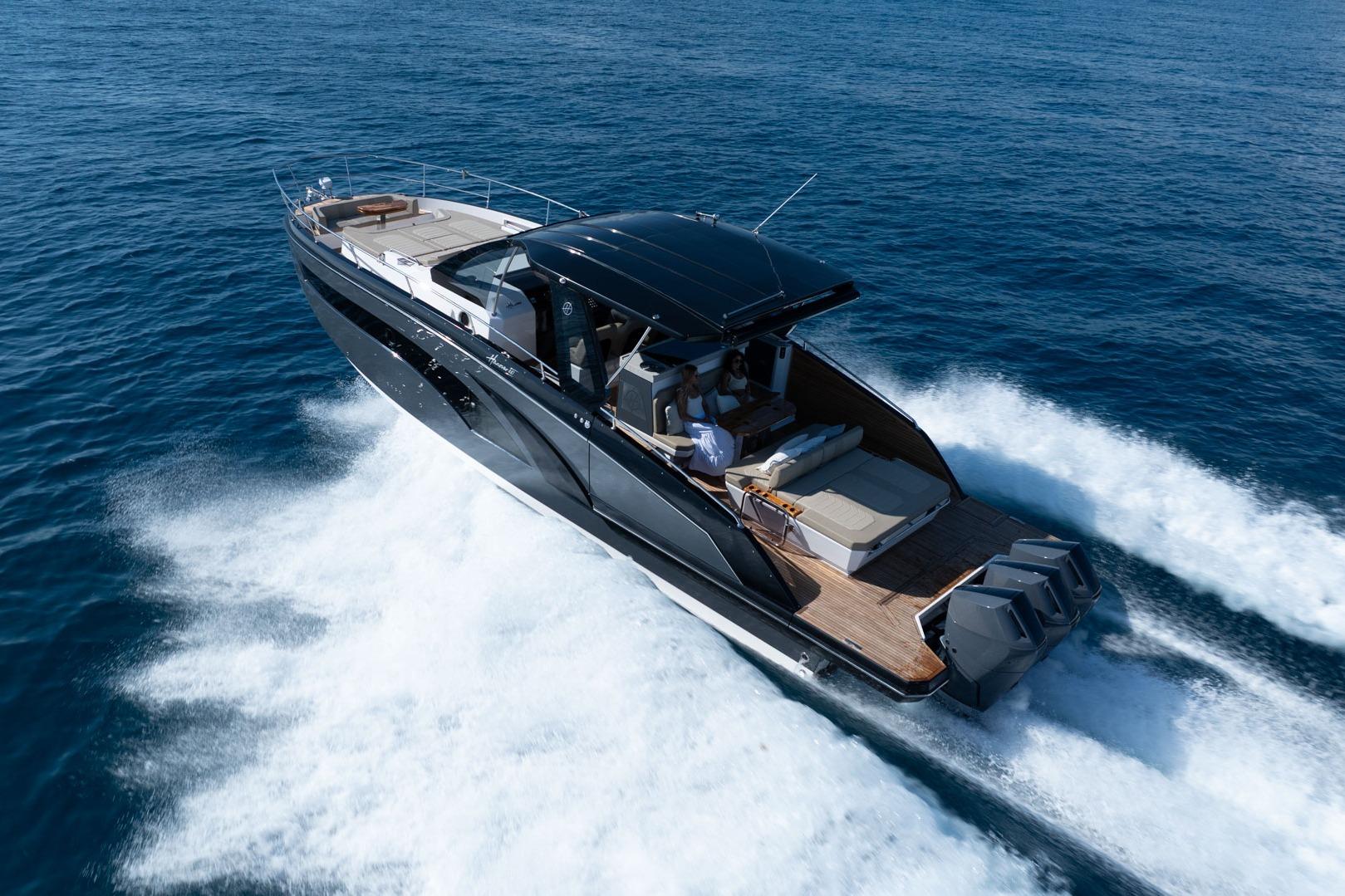 Luxurious 2026 Hanover 447 yacht cruising on open sea, showcasing sleek design and powerful engines.
