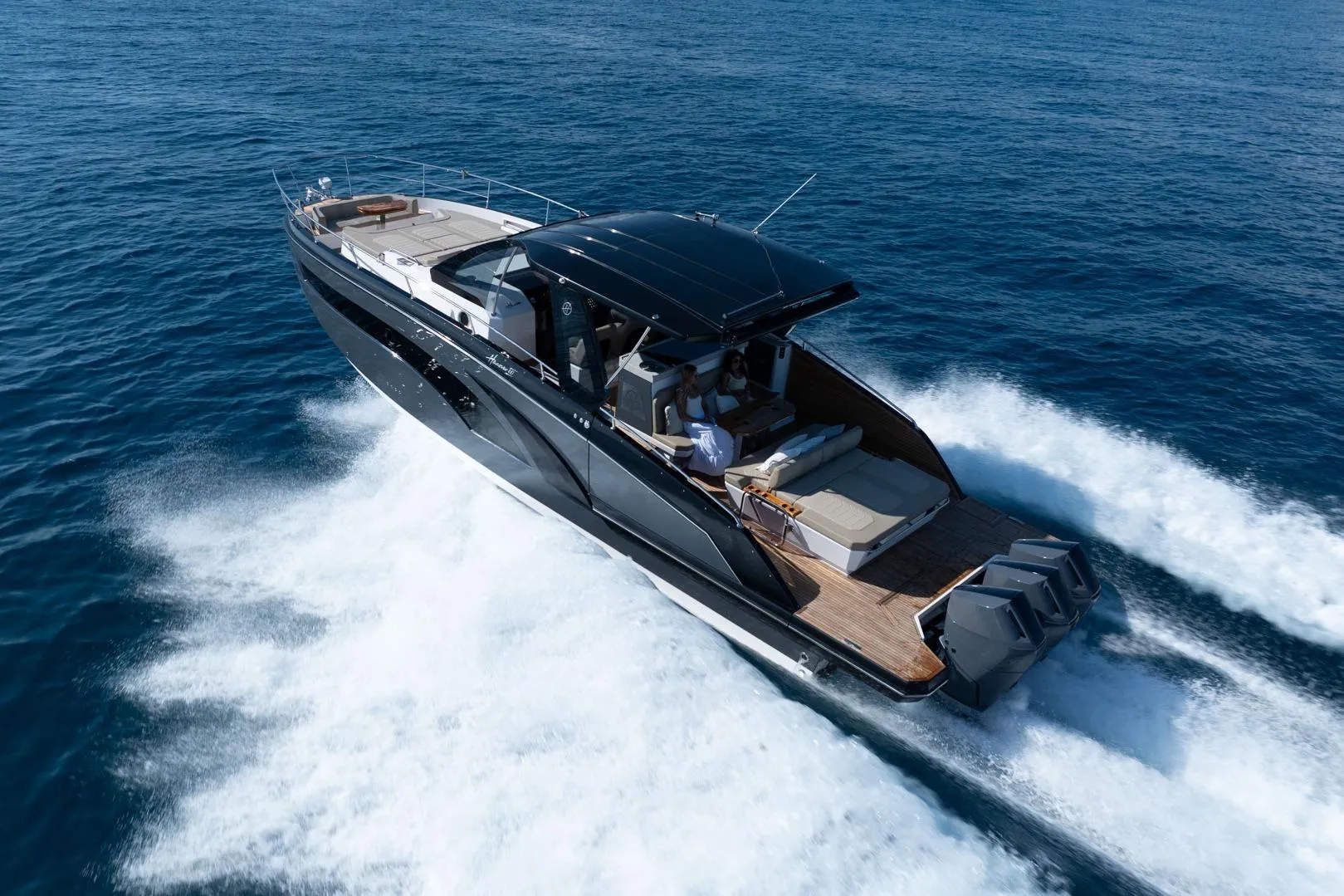 Luxurious 2026 Hanover 447 yacht cruising on open sea, showcasing sleek design and powerful engines.