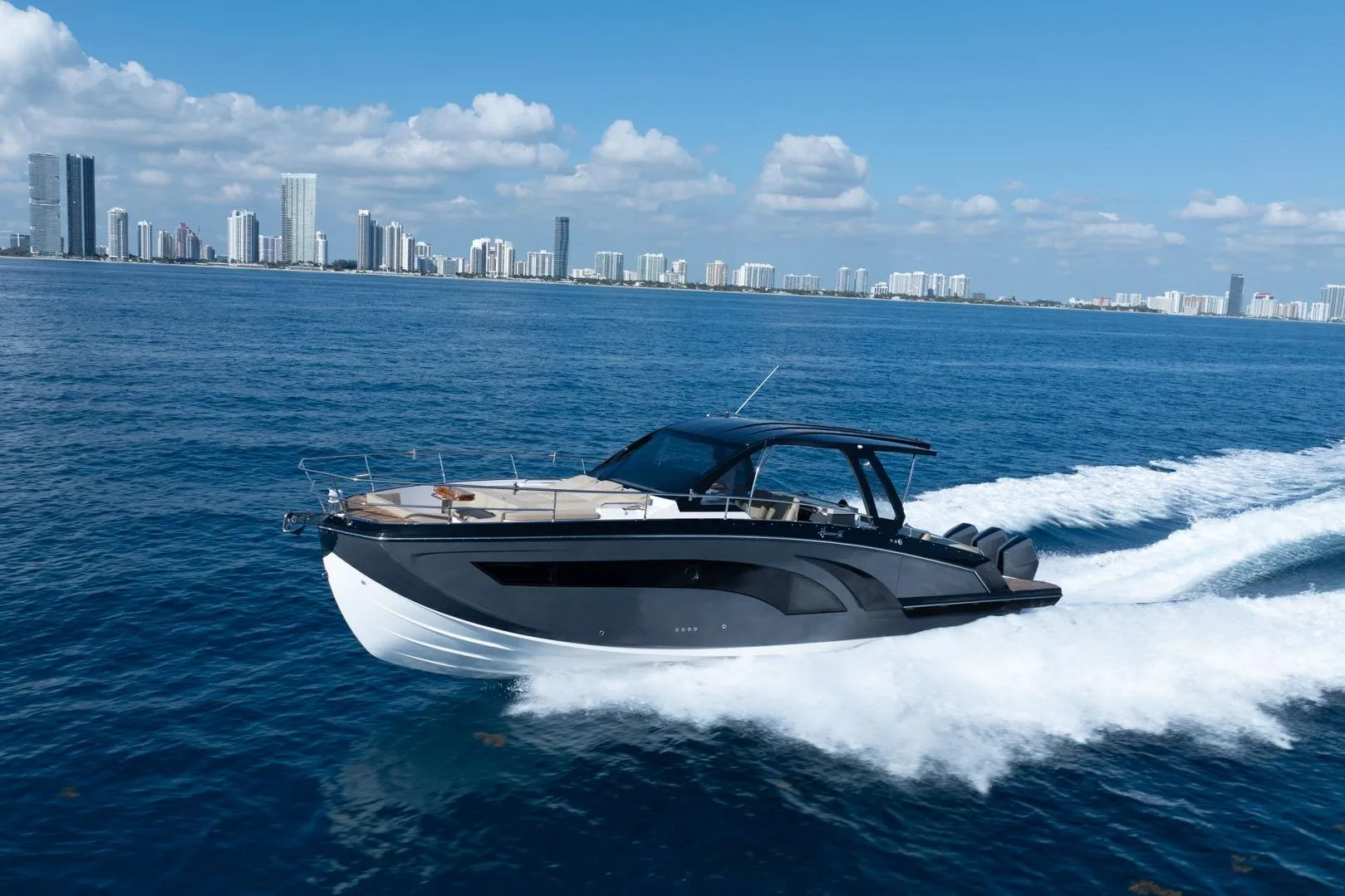 Luxury Hanover 447 yacht cruising near city skyline, 2026 model.