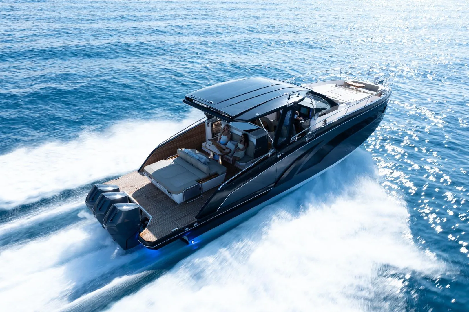 Luxurious 2026 Hanover 447 yacht cruising swiftly on open blue waters.