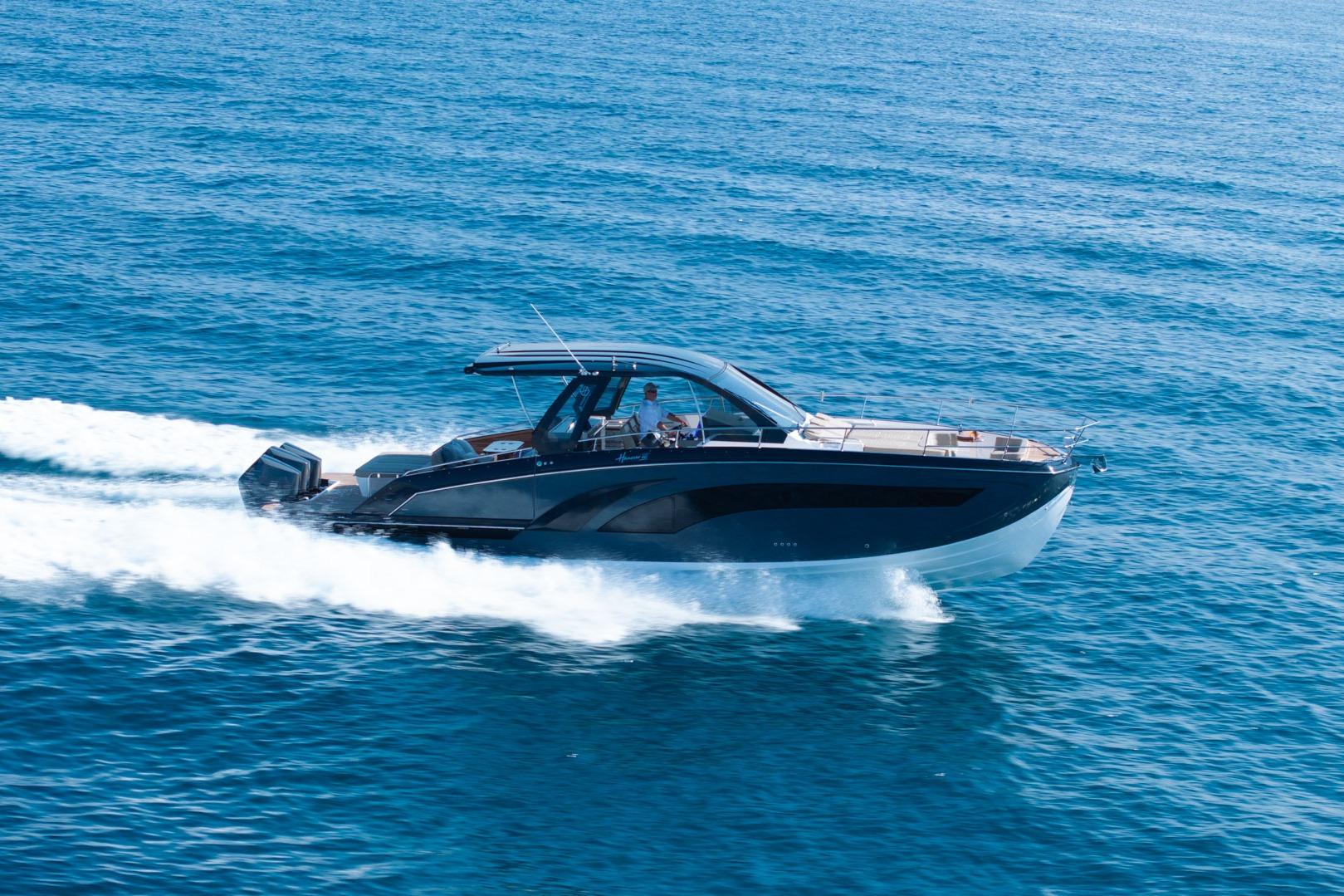 2026 Hanover 447 boat cruising on open blue sea.