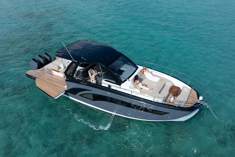  Yacht Photos Pics Luxurious 2026 Hanover 447 yacht cruising on clear turquoise waters.