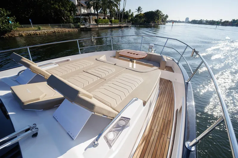  Yacht Photos Pics Luxurious Hanover 447 yacht deck with sun loungers, cruising on a sunny day, 2026 model.