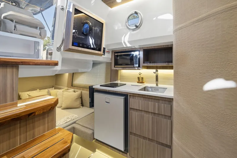  Yacht Photos Pics Luxurious Hanover 447 yacht interior with modern kitchen and cozy seating, 2026 model.