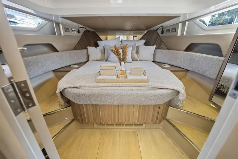  Yacht Photos Pics Luxurious interior of 2026 Hanover 447 yacht with elegant bedding and modern design.
