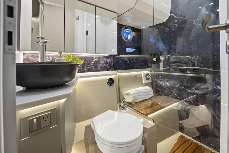  Yacht Photos Pics Luxurious bathroom in 2026 Hanover 447 yacht with modern fixtures and elegant design.