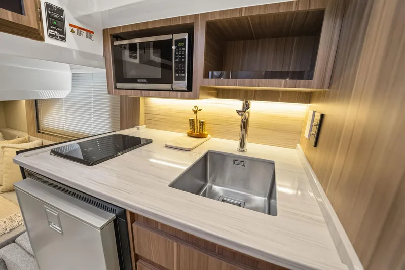  Yacht Photos Pics Modern RV kitchen interior with sleek appliances, Hanover 447 model, 2026.