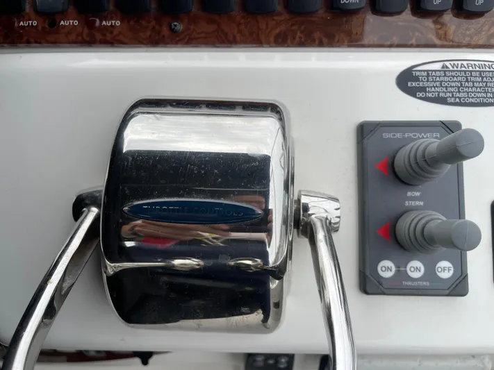 Queen Alexia Yacht Photos Pics Throttle and side-power controls on a 2005 Meridian 341 Sedan boat.